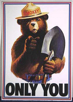 Smokey Bear holding a shovel and pointing, with text reading "Only You".