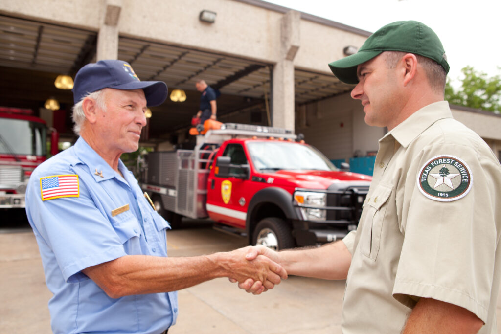 TAMFS agent shaking hands with a VFD member