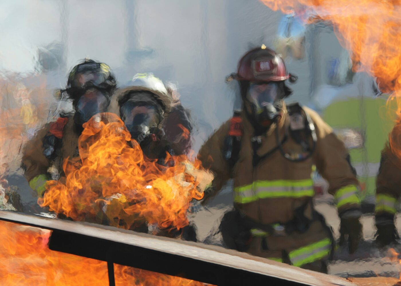 Firefighters surrounded by flames