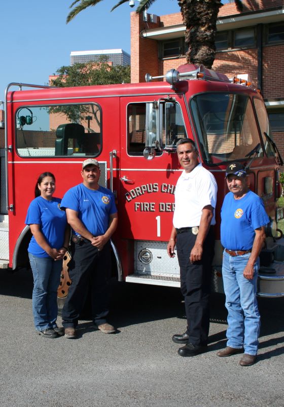 Firefighters in front of fire truck