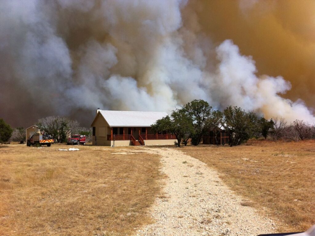 Home in front of wildfire smoke