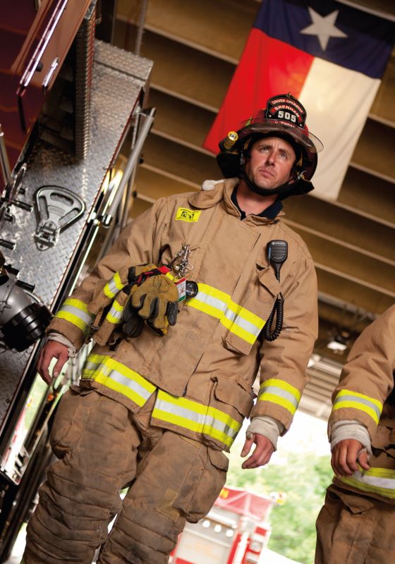 Firefighter walking with full gear on