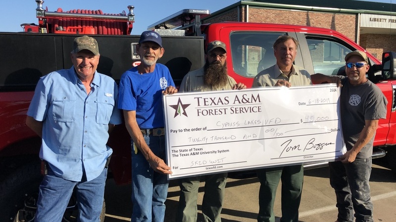 The cyber slake fire department being presented with a grant