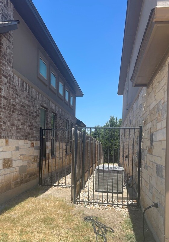 a large gap maintained between two houses, demonstrating fire resistant construction
