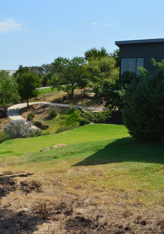 open ground surrounding a house to demonstrate fire resistant landscaping