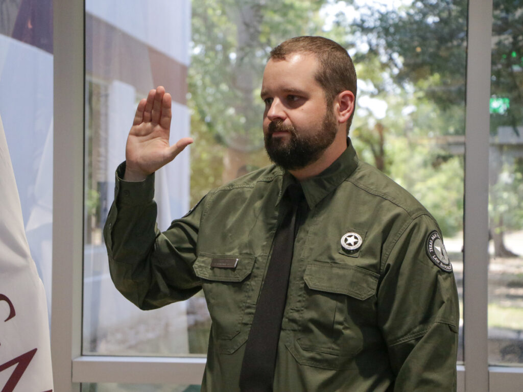 A man being sworn in as a Texas A&M Forest Service Law Enforcement officer.