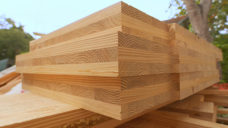Image of the corner of a stack of cross laminated timber.